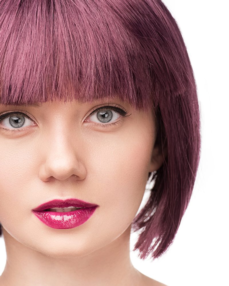 close up portrait of attractive girl with purple hair isolated on white